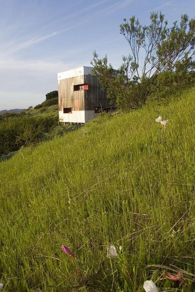 A small modern cabin built with straw bales. | www.facebook.com/SmallHouseBliss