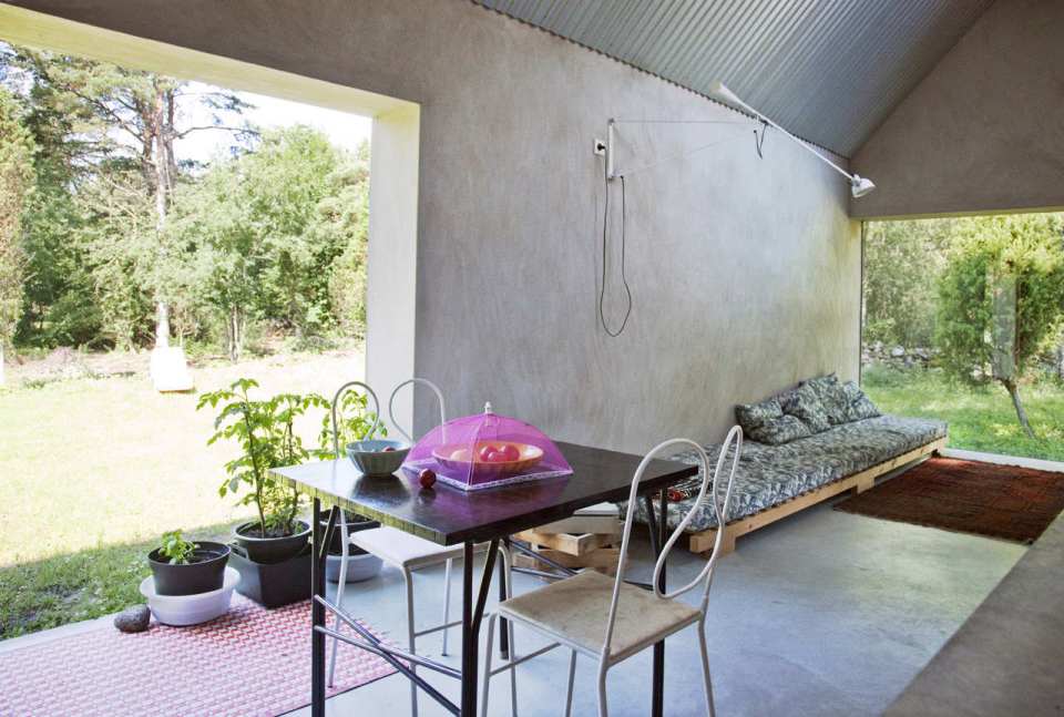 This small summer house in Sweden was inspired by local barns. It has an open interior with two sleeping spaces in 689 sq ft. Straightforward design and simple materials kept the cost down. | www.facebook.com/SmallHouseBliss