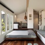 Minim House, a 242 sq ft tiny house with multi-functional furniture and a pull-out bed instead of the usual sleeping loft. | www.facebook.com/SmallHouseBliss