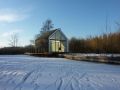 This tiny 226 sq ft lake house opens to the outdoors with a folding wall. 2by4-architects has also designed a prefab version. | www.facebook.com/SmallHouseBliss