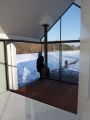 This tiny 226 sq ft lake house opens to the outdoors with a folding wall. 2by4-architects has also designed a prefab version. | www.facebook.com/SmallHouseBliss