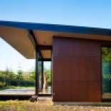 This modern cabin by Olson Kundig Architects is open to nature with glass walls on three sides. It has 500 sq ft of studio living space. | www.facebook.com/SmallHouseBliss