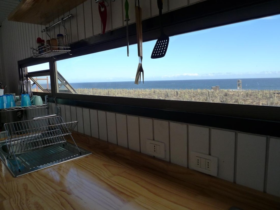 Located near a beach in Chile, this camping compound has a shipping container kitchen/bath, water tower and tent pads. | www.facebook.com/SmallHouseBliss
