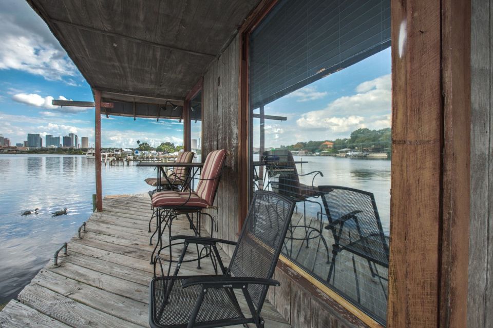 A ramshackle exterior conceals a modern one-bedroom home in this dock house perched over a river within sight of downtown Tampa, Florida. | www.facebook.com/SmallHouseBliss