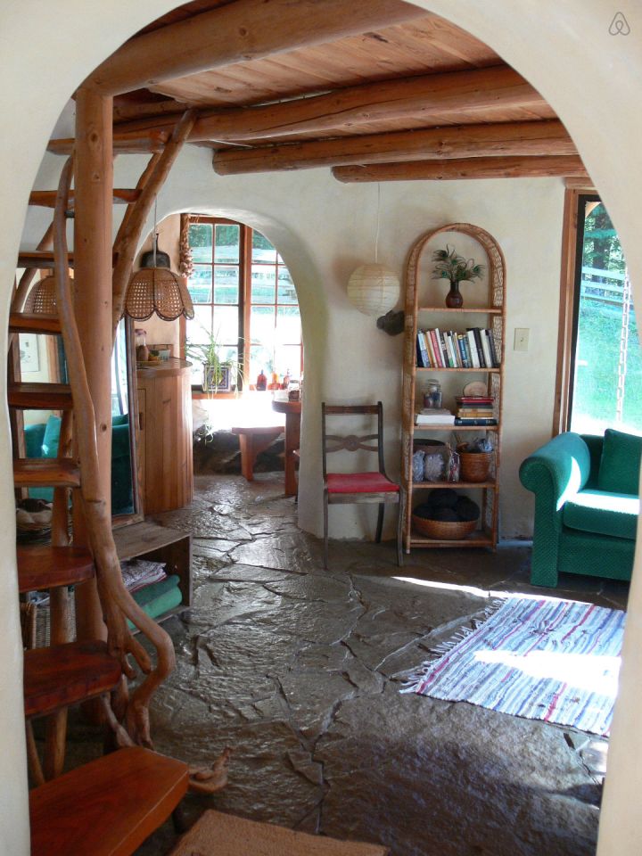 A one-bedroom storybook cottage with curved walls sculpted from cob, a mixture of clay, sand and straw. | www.facebook.com/SmallHouseBliss