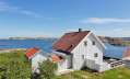 This traditional style family vacation cottage sits on a rugged island on Sweden's west coast. It has three bedrooms in 1,087 sq ft. | www.facebook.com/SmallHouseBliss