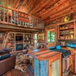 The rustic Cowboy Cabin was built from salvaged materials. The 12'x28' cabin has 2 sleeping lofts. | www.facebook.com/SmallHouseBliss