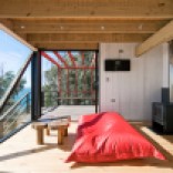A low-cost "surf shack" cabin overlooking the ocean in Chile. Shared by two brothers, it has two small bedrooms in 555 sq ft. | www.facebook.com/SmallHouseBliss