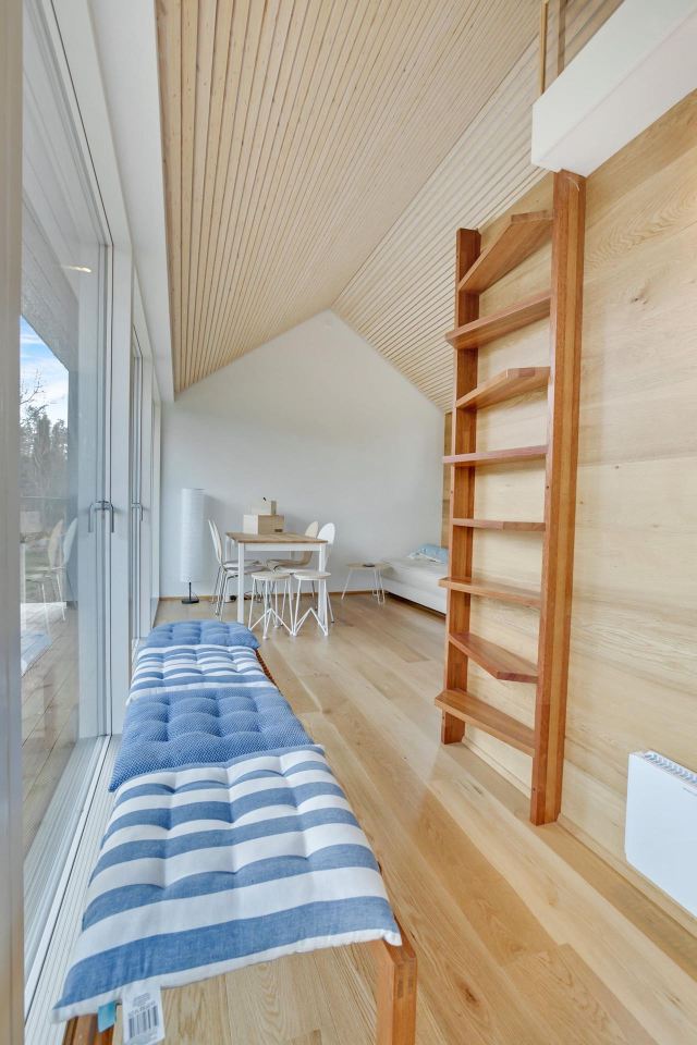This Scandinavian Modern tiny house in Denmark has a 258 sq ft studio floor plan with sleeping loft. | www.facebook.com/SmallHouseBliss