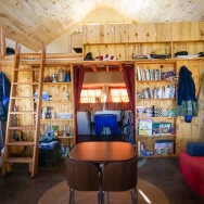 This small straw bale house is off the grid on 40 acres of Colorado pasture, forest and canyon. It has one bedroom on the 468 sq ft ground floor plus a loft. | www.facebook.com/SmallHouseBliss