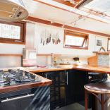 A canal barge built in 1908 was converted into this comfortable two-bedroom houseboat in Amsterdam. | www.facebook.com/SmallHouseBliss