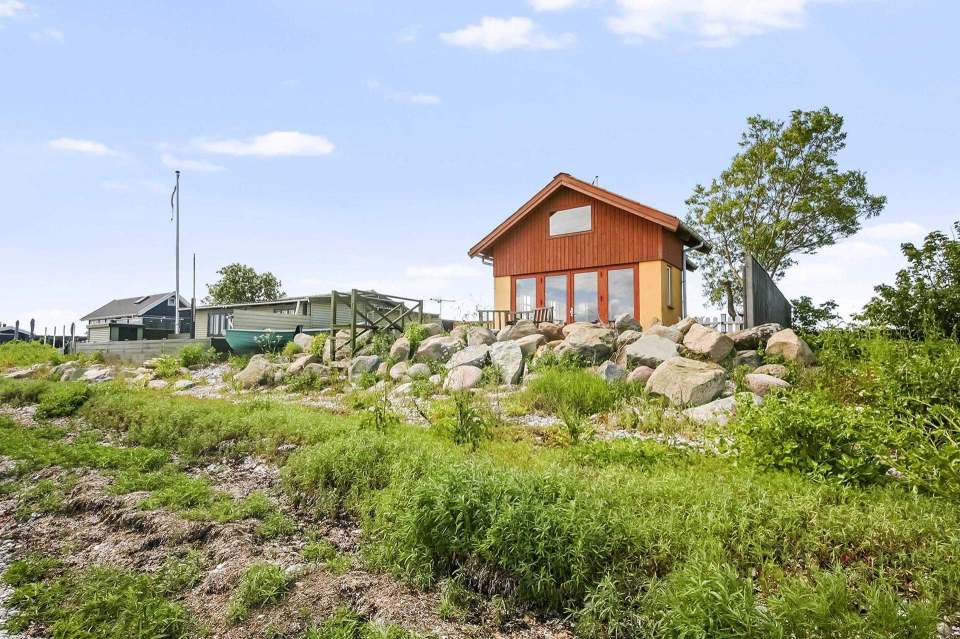 This tiny beachfront cottage in Denmark has 172 sq ft on the ground floor plus a sleeping loft. | www.facebook.com/SmallHouseBliss