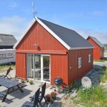 This Danish summerhouse was inspired by the neighboring fishermen's sheds. It has one bedroom on the 375 sq ft ground floor, plus a sleeping loft. | www.facebook.com/SmallHouseBliss
